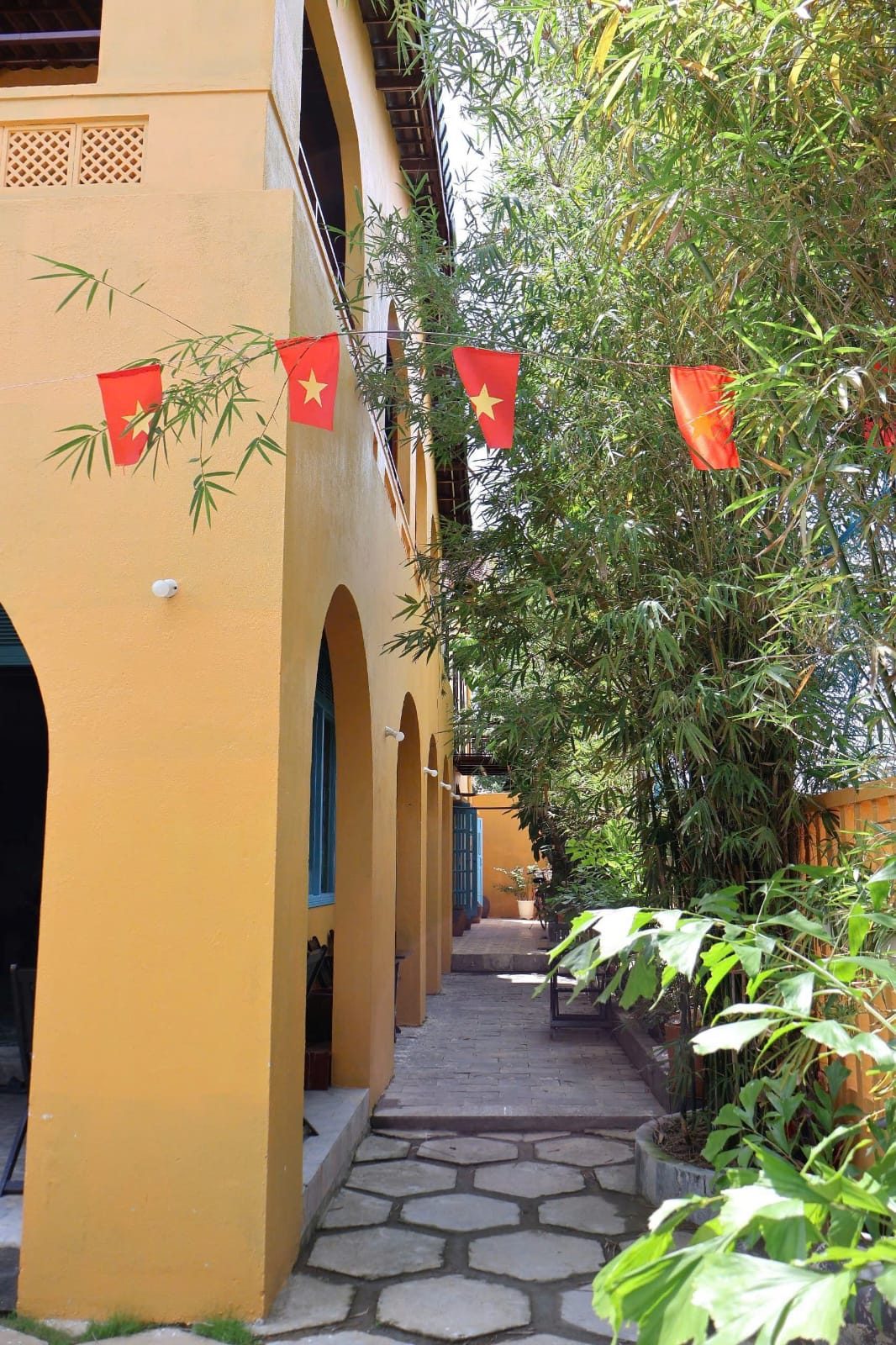 A walkway through time — bamboo and golden walls at Tre Hoi An